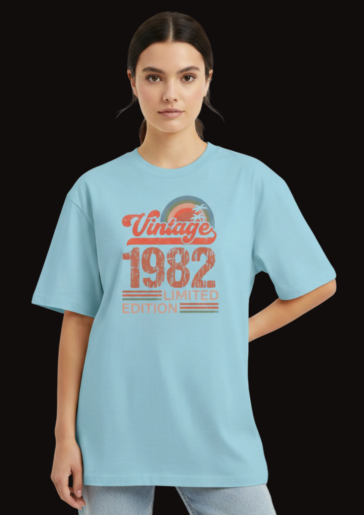 Person wearing a light blue t-shirt with 'Vintage 1982 Limited Edition' text on a plain background