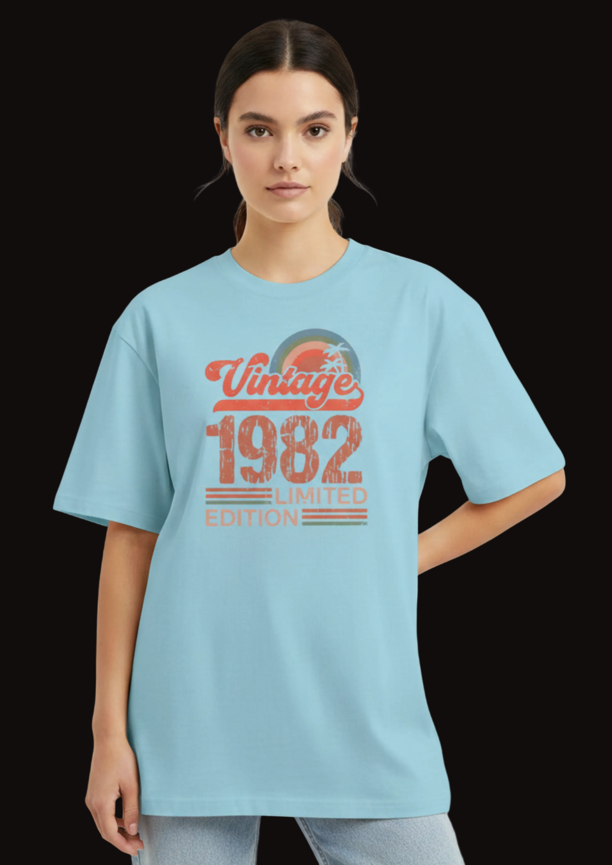 Person wearing a light blue t-shirt with 'Vintage 1982 Limited Edition' text on a plain background