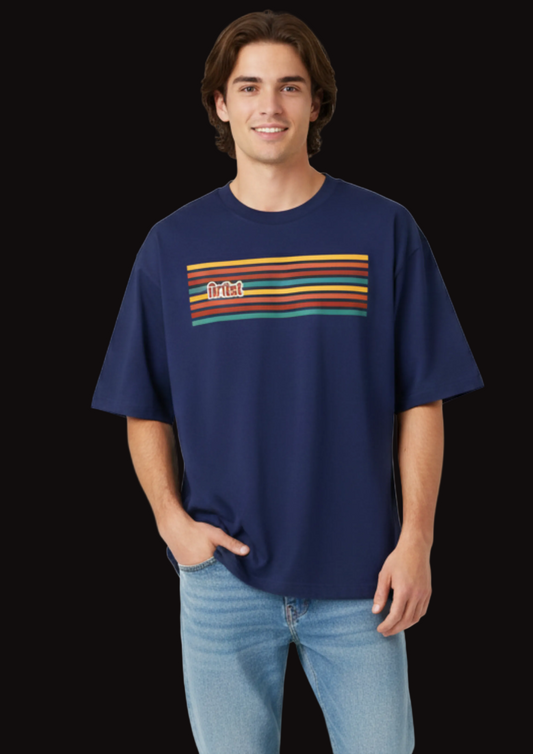 Man wearing a navy blue t-shirt with colorful stripes and a logo on a white background