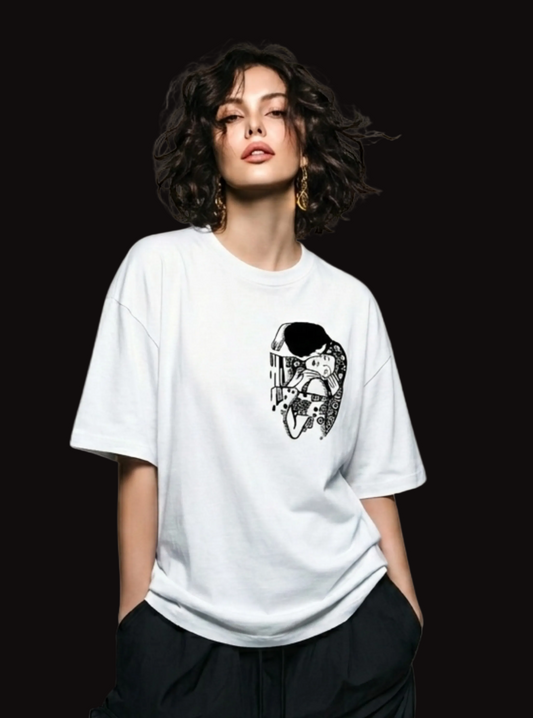 Woman wearing a white t-shirt with a graphic design on a beige background